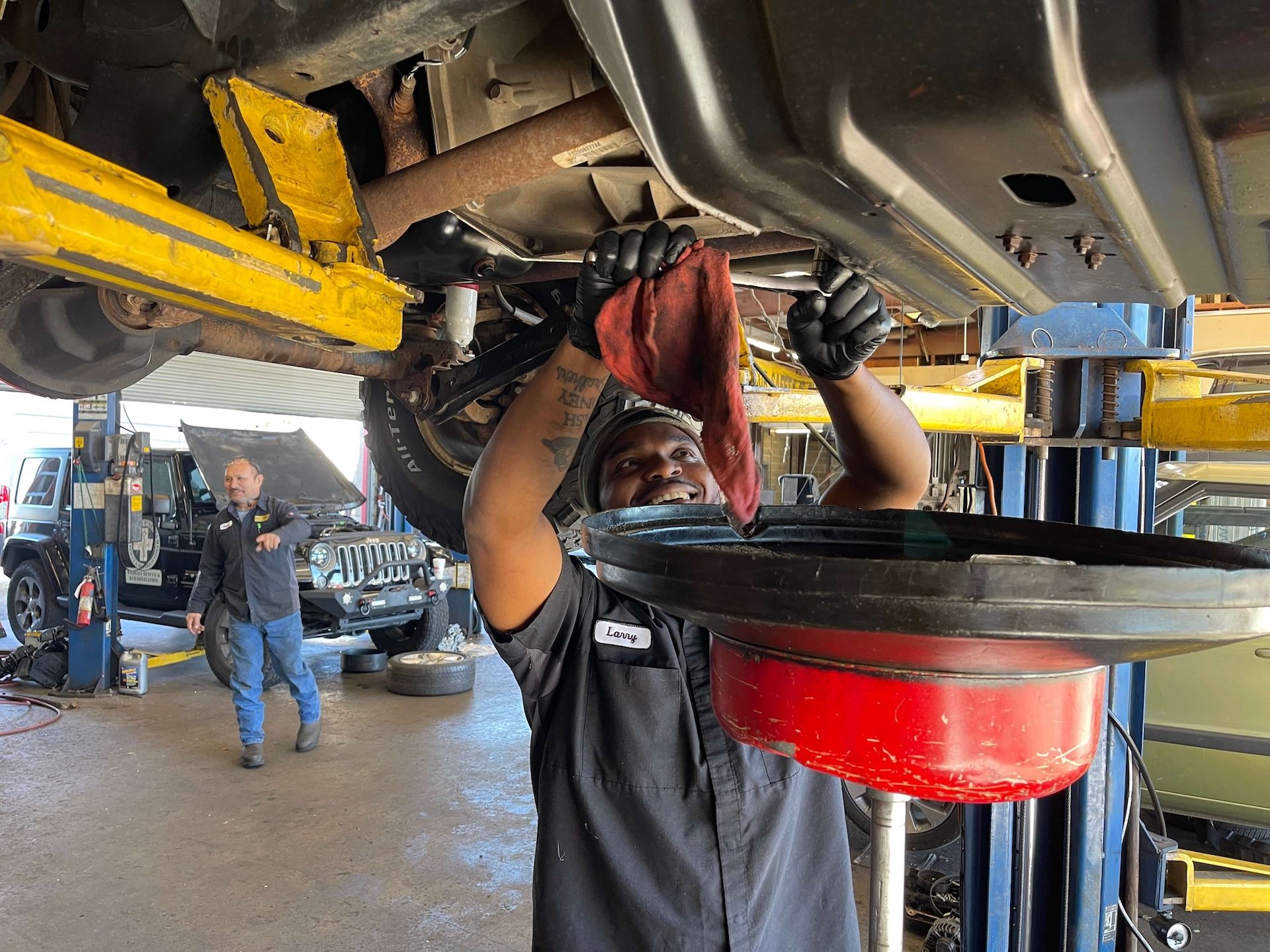 mechanic-working-on-car-on-lift